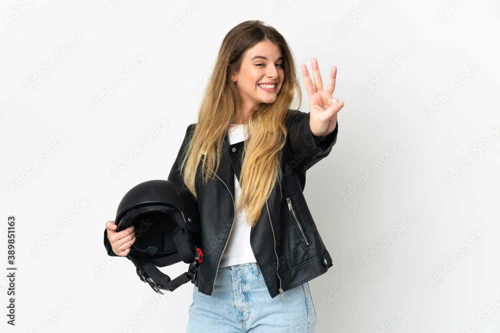 Woman holding a motorcycle helmet isolated on white background happy and counting three with fingers Woman holding a motorcycle helmet isolated on white background happy and counting three with fingers