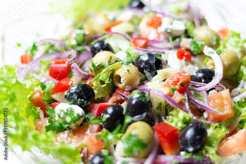 greek salad texture with feta cheese, olives, tomato, onion, cucumber, parsley, oil