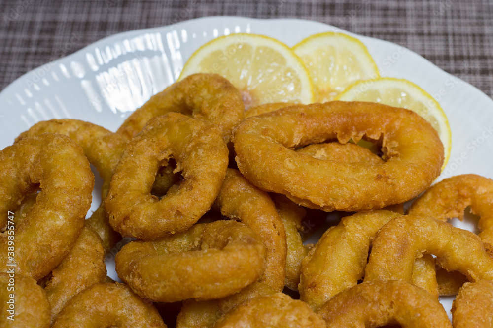 Plate of breaded squid rings. Roman-style squid rings Plate of breaded squid rings. Roman-style squid rings