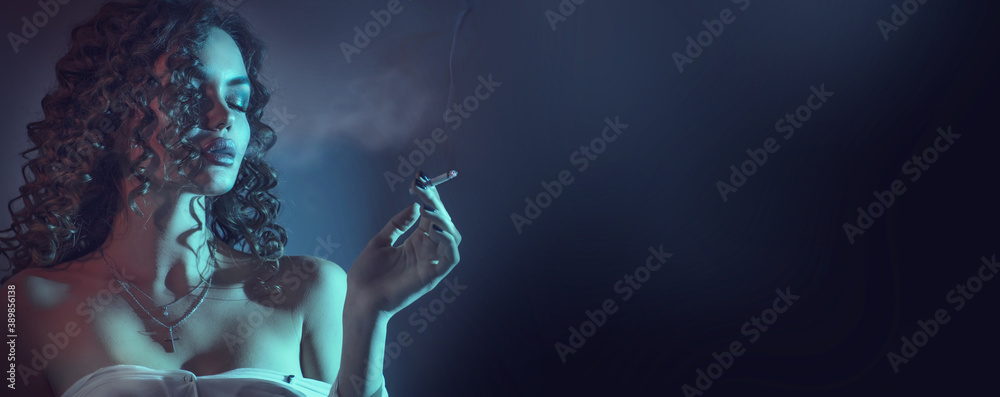 Beautiful smoking young woman, closeup portrait, at night. Beauty fashion sexy model girl with cigarette. Close eyes. Darkness - obrazy, fototapety, plakaty 