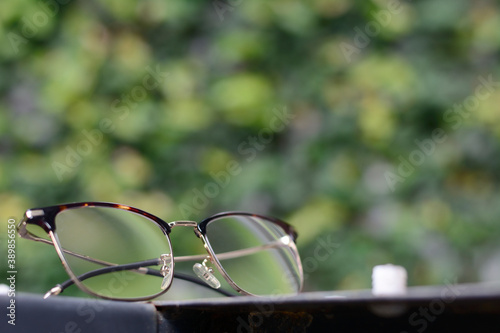 Eyeglasses on natural background. Lifestyle concept. © Siwapot Narukietmont