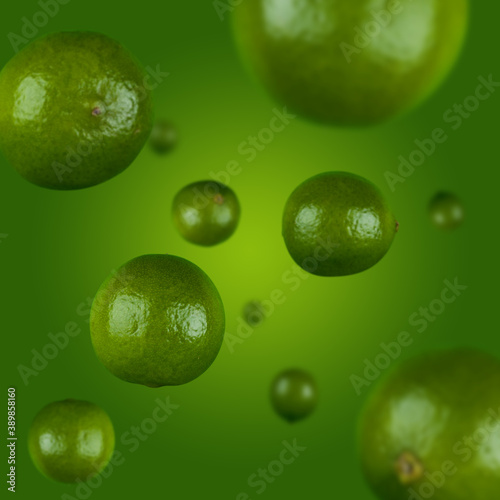 Many limes free falling on gradient green background. Selective focus - shallow depth of field.