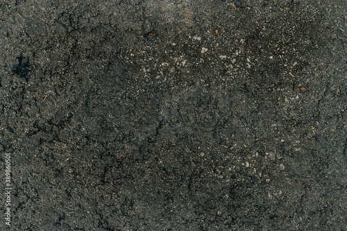 Fototapeta Naklejka Na Ścianę i Meble -  interesting dark gray cracked original background old asphalt