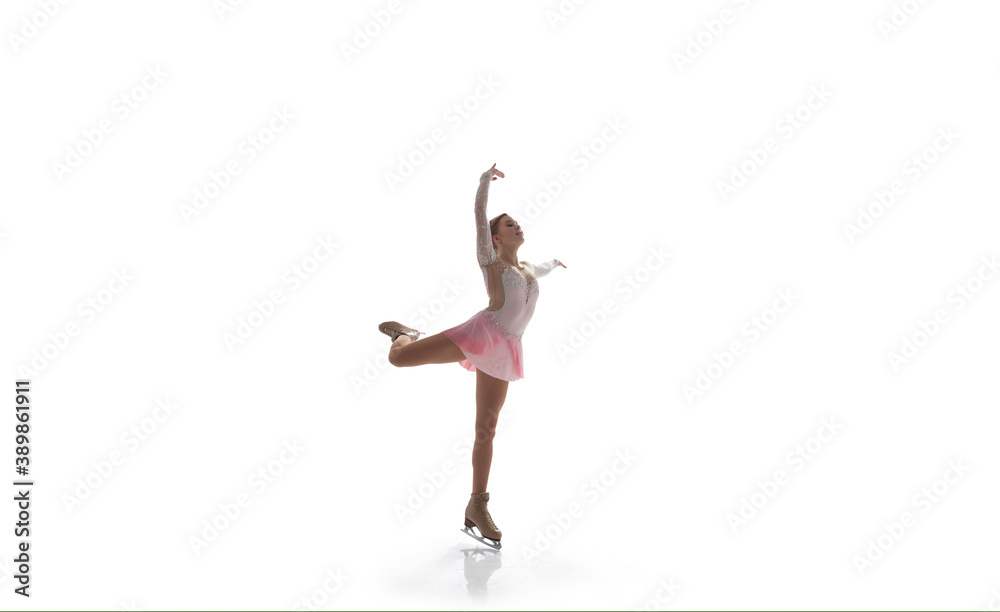 Obraz premium Figure skating girl in ice arena isolated on white.