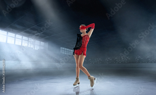 Figure skating girl in ice arena.
