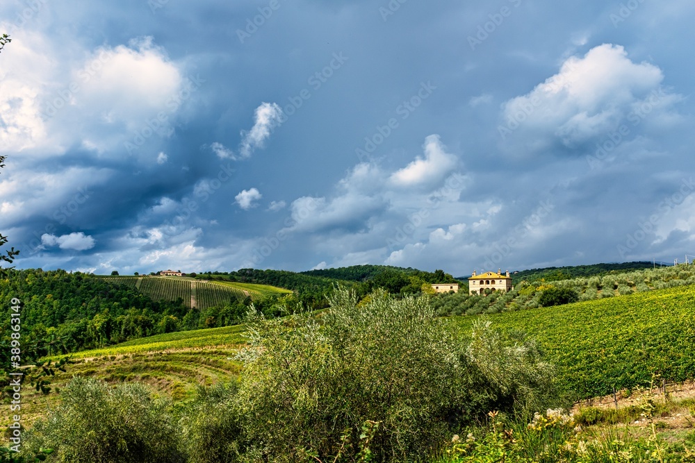 Picturesque Farm Field in Rural Tuscany with Clouds