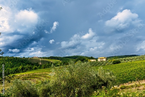 Picturesque Farm Field in Rural Tuscany with Clouds © Nektarstock