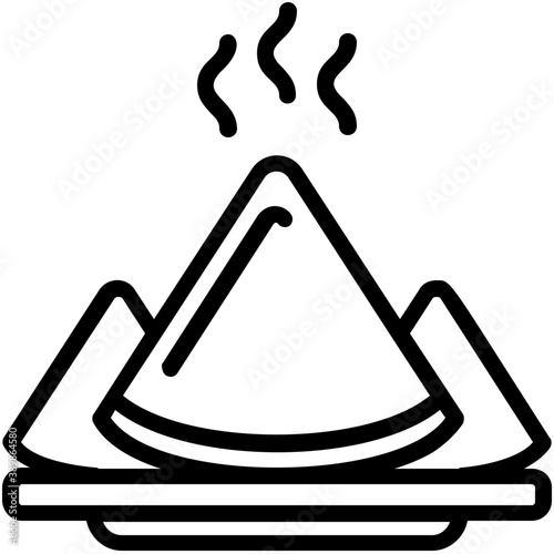 
Spicy and hot traditional food in triangle shape  stuffed with filing conceptualizing samosas 
