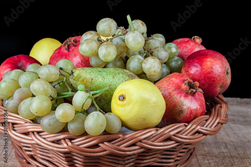 pomegranates and other fruit in the basket