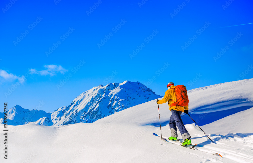 Skitouring with amazing view of swiss famous mountains in beautiful winter powder snow of Alps.