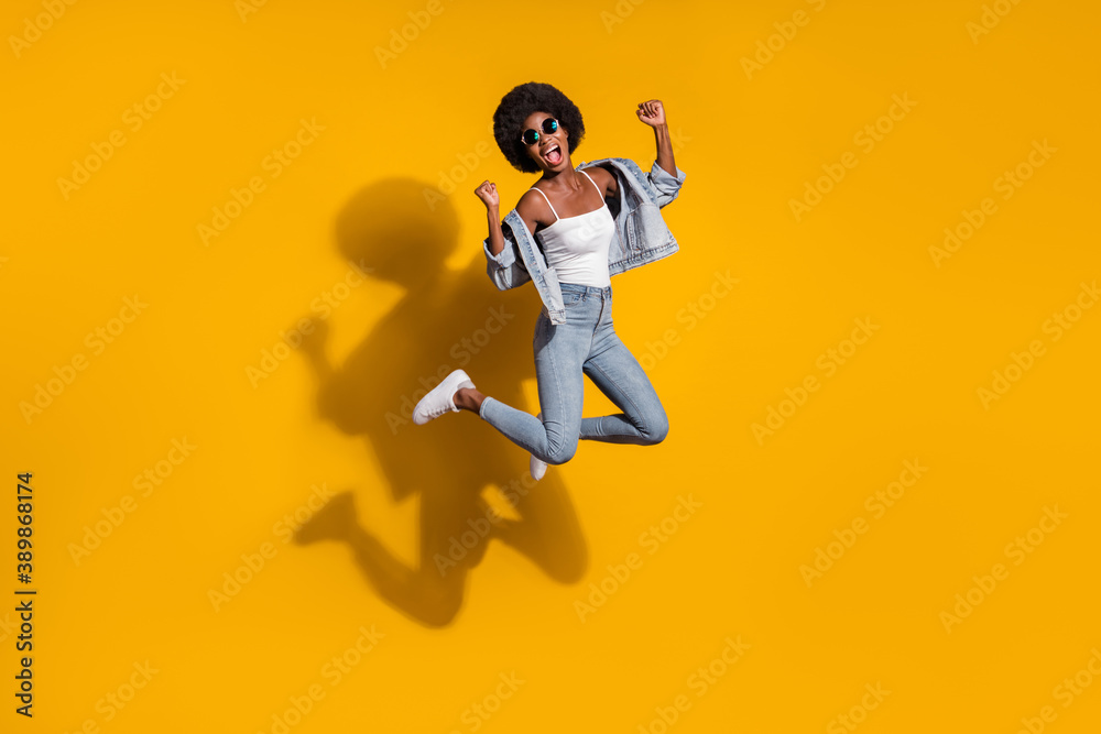 Full size photo of pretty trendy brown haired girl jump air wear singlet jeans summer isolated on bright color background