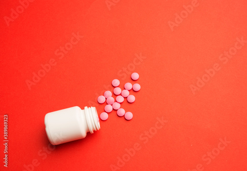 Spilled pills or tablets as pattern from a plastic drugs bottle