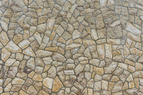 A background, a stone wall with irregular joints.