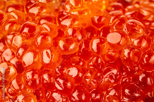 Red caviar. Fresh salmon caviar as a natural background close-up.