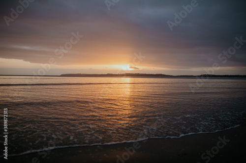 Golden sunrise at Orewa Beach in New Zealand