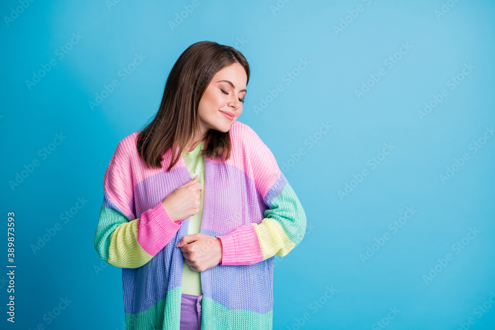 Photo of adorable pretty brown haired happy young woman closed eyes enjoy isolated on shine blue color background Photo of adorable pretty brown haired happy young woman closed eyes enjoy isolated on shine blue color background