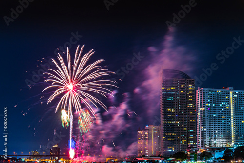 Firework display for celebration happy new year and merry christmas with Twilight night and firework lighting in bangkok cityscape, Thailand.