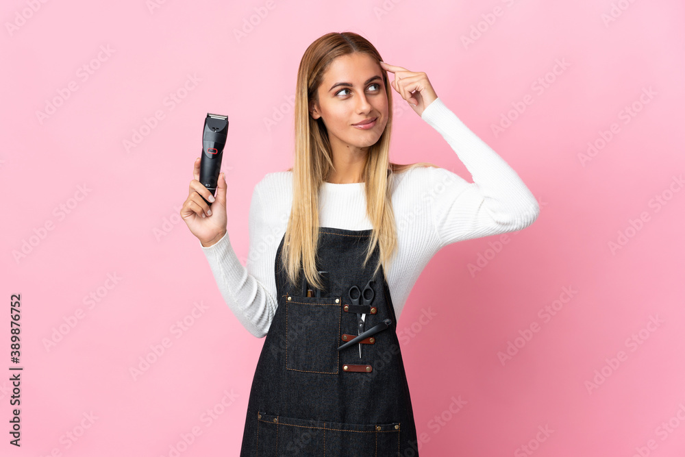 Young hairdresser woman isolated on pink background having doubts and thinking Young hairdresser woman isolated on pink background having doubts and thinking