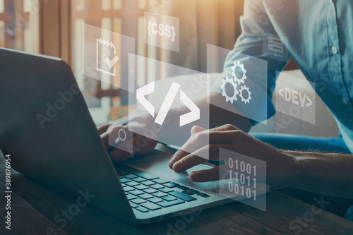 Coding software concept, developer work on computer writing programming code. photo