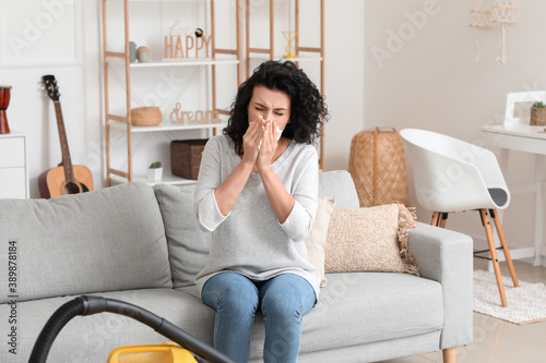 Allergic woman cleaning her...