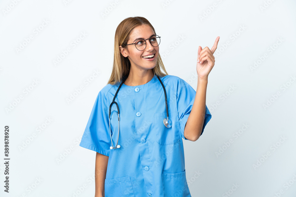 Surgeon doctor woman over isolated white background pointing up a great idea Surgeon doctor woman over isolated white background pointing up a great idea