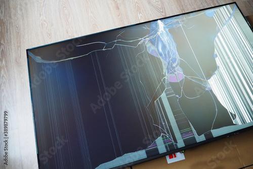 Broken led TV matrix. Damage to the screen of a modern TV as a result of impact or fall.