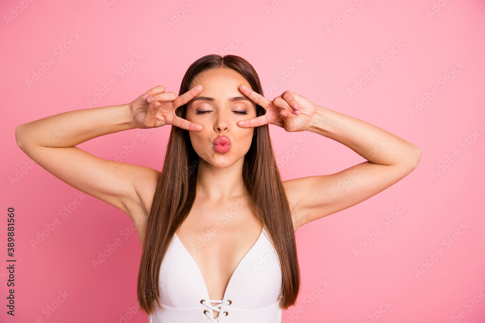 Close-up portrait of her she nice attractive lovely charming sweet gorgeous straight-haired lady showing double v-sign near eye sending kiss isolated over pink pastel background