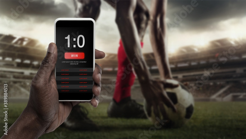 Fotografering Smartphone screen with mobile app for betting and score