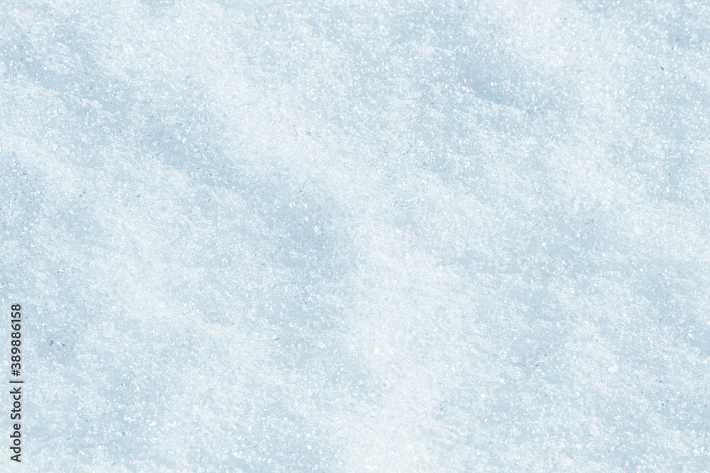 Blue snow surface background - top view of fresh snow texture on the ground