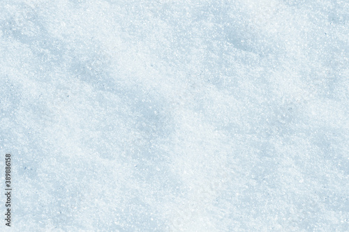 Blue snow surface background - top view of fresh snow texture on the ground