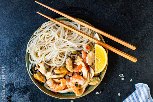 rice noodles seafood cellophane pasta shrimp, mussels, squid ingredient for preparing healthy meal snack top view copy space for text food background rustic