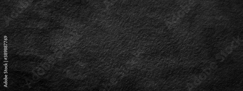 Panel kuchenny z motywem Abstract black stone wall, background - in the form of a rough embossed stone surface, closeup