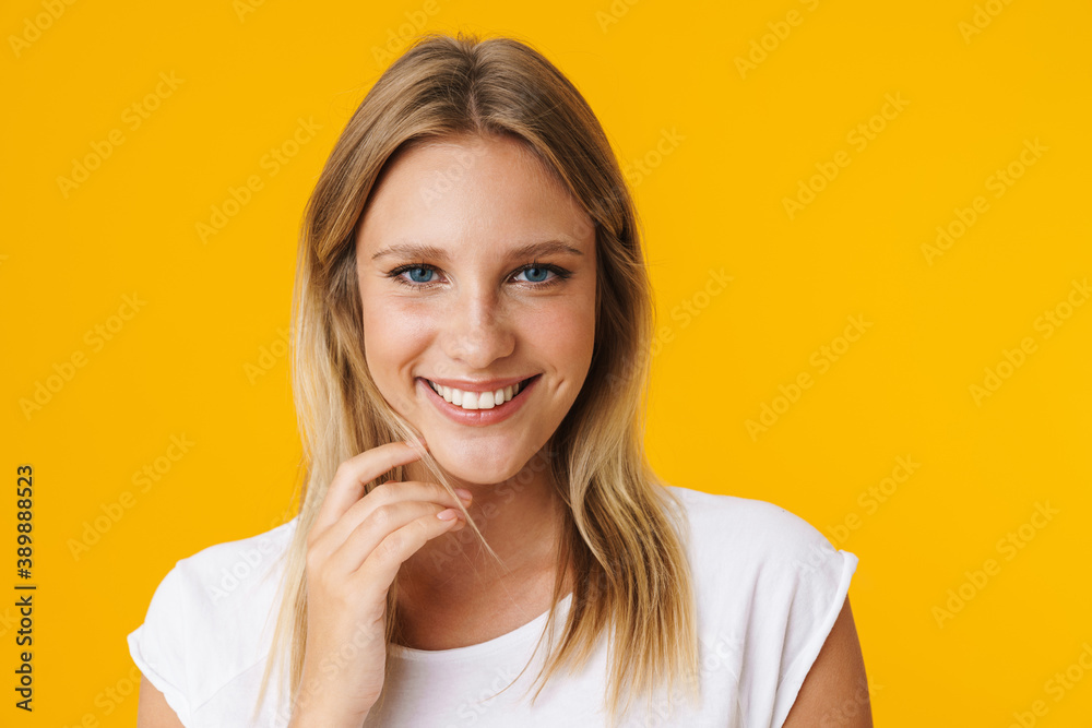 Cheerful beautiful girl smiling and looking at camera Cheerful beautiful girl smiling and looking at camera