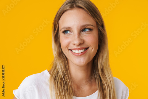 Cheerful beautiful girl smiling and looking aside