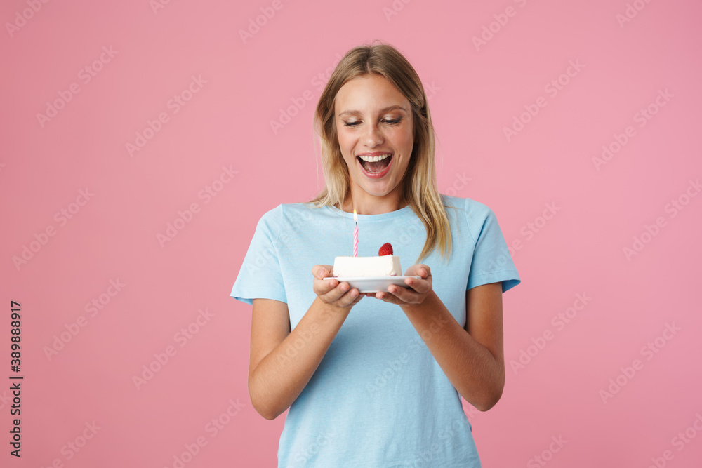 Happy beautiful girl smiling while posing with birthday cake Happy beautiful girl smiling while posing with birthday cake