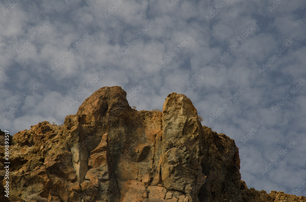 Fototapeta premium Rocky cliff and clouds in Medio Almud. Mogan. Gran Canaria. Canary Islands. Spain.
