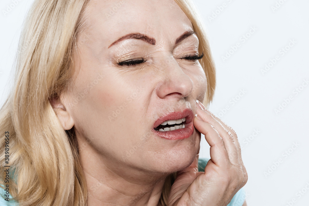 Girl is sick and holding on to a bad tooth in jaw. Girl is sick and holding on to a bad tooth in jaw.