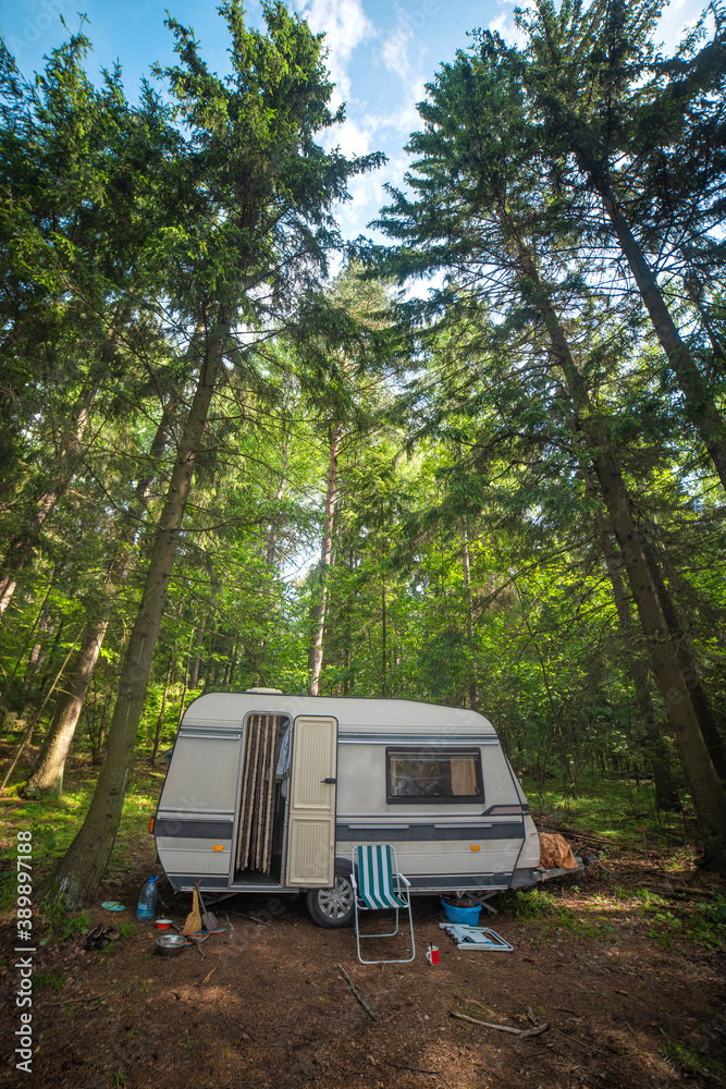 camper in the forest by the lake