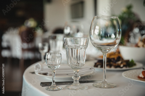 glass goblets and glasses on the serving table for the banquet  Empty glasses in restaurant
