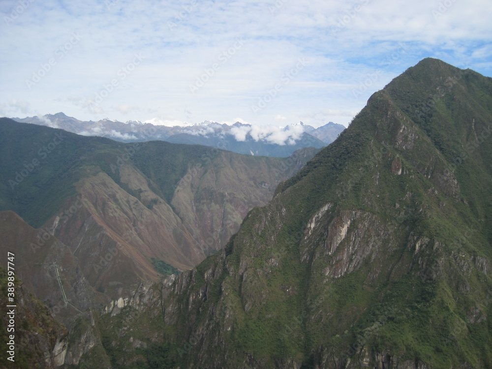 Hiking the Inca Trail through the beautiful green lush mountains to Huayna and Machu Picchu in Peru, South America