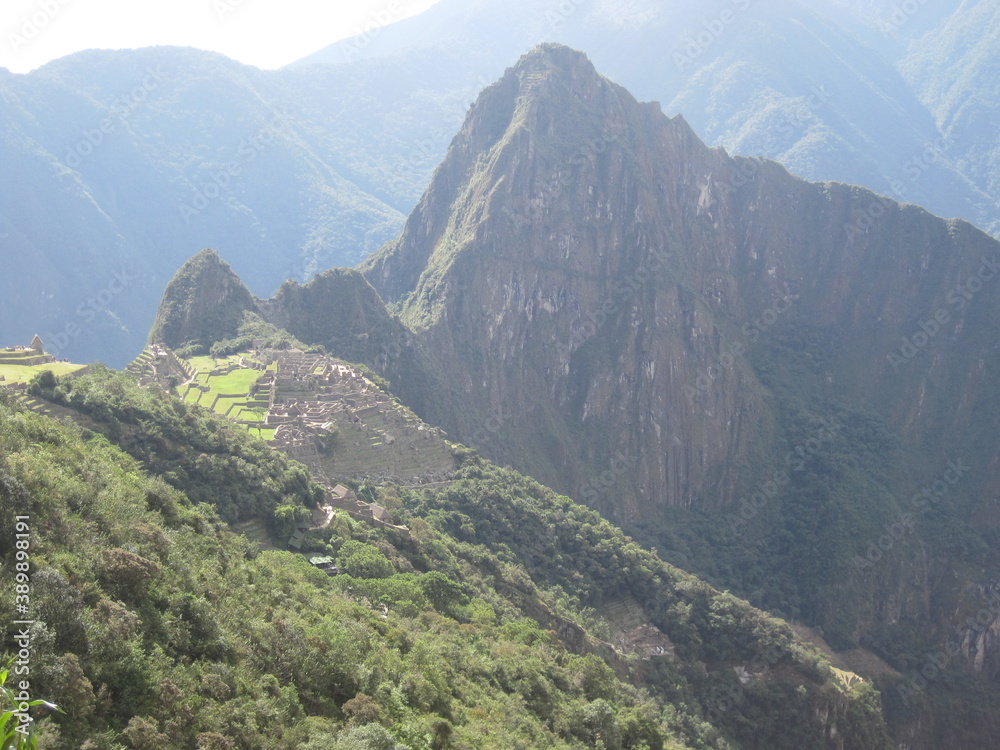 Hiking the Inca Trail through the beautiful green lush mountains to Huayna and Machu Picchu in Peru, South America Hiking the Inca Trail through the beautiful green lush mountains to Huayna and Machu Picchu in Peru, South America