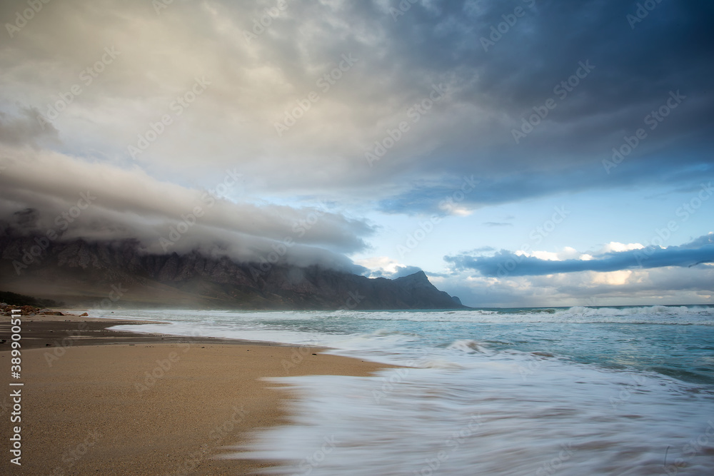 Wide angle view of Kogelbay beach as a cold winter coldfront moves in over the Western Cape of South Africa