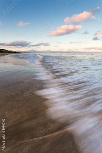 Wide angle close up view of a wave washing up on the very popular holiday destination of Diaz Beach in Mosselbay in the Garden Route in the Western Cape in South Africa photo