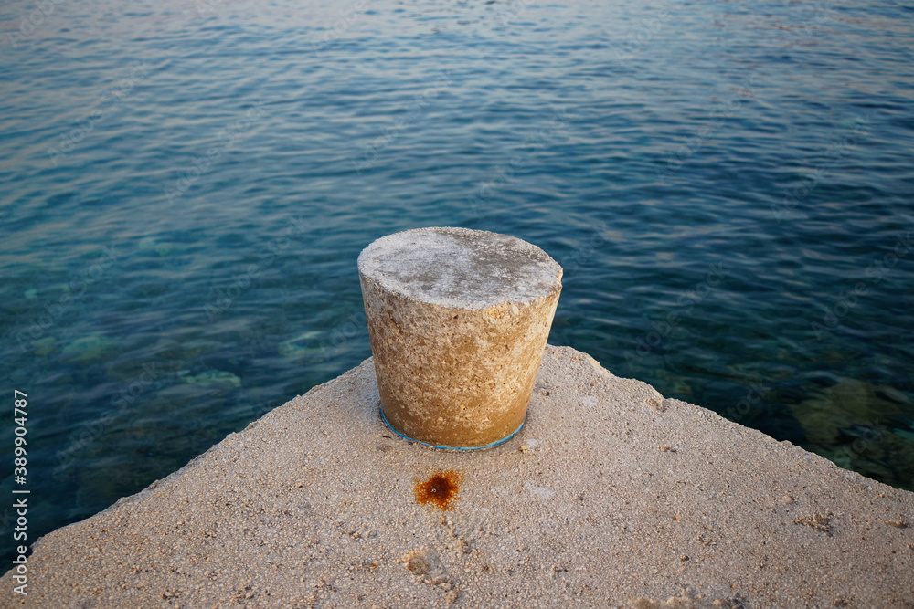 high angle view of an concrete triangular pier with turquoise water