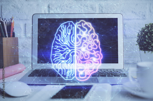 Double exposure of work space with computer and human brain drawing hologram. Brainstorm concept.