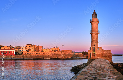 Obraz na płótnie Egyptian or Venetian Lighthouse of Old Venetian harbour of Chania, Crete, Greece at sunrise. Soft sky colors from blue to pink, Firka castle walls. w salonie