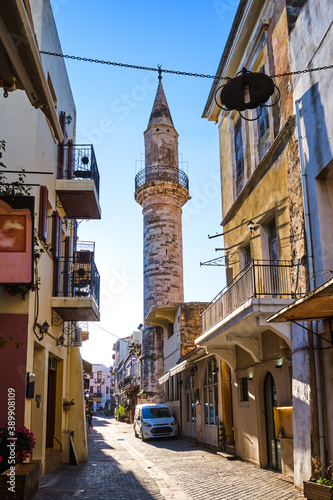 Fototapeta Naklejka Na Ścianę i Meble -  Beautiful view of narrow streets of old town of Chania, Crete, Greece in early morning. Historic monument of Ottoman era Ahmet-aga minaret.