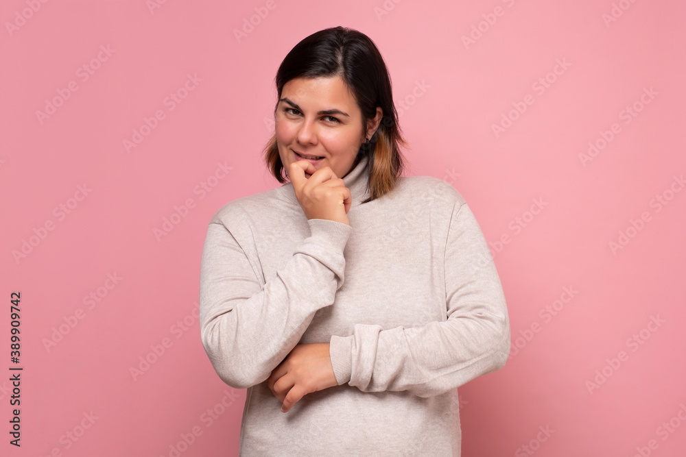 Portrait of a smiling thinking woman making a plan. Portrait of a smiling thinking woman making a plan.