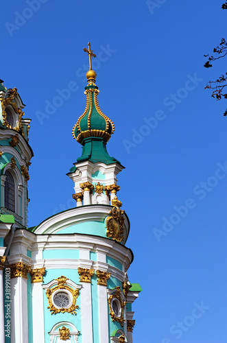 Close-up view the top of charming Saint Andrew Church against blue sky. It is a major Baroque church. It was constructed between 1747 and 1754,design by the Italian architect Bartolomeo Rastrelli