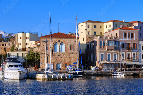 Sailing boats anchored by piers of Old Venetian harbour and Grand Arsenal  Venetian shipyard  in Chania  Crete  Greece.